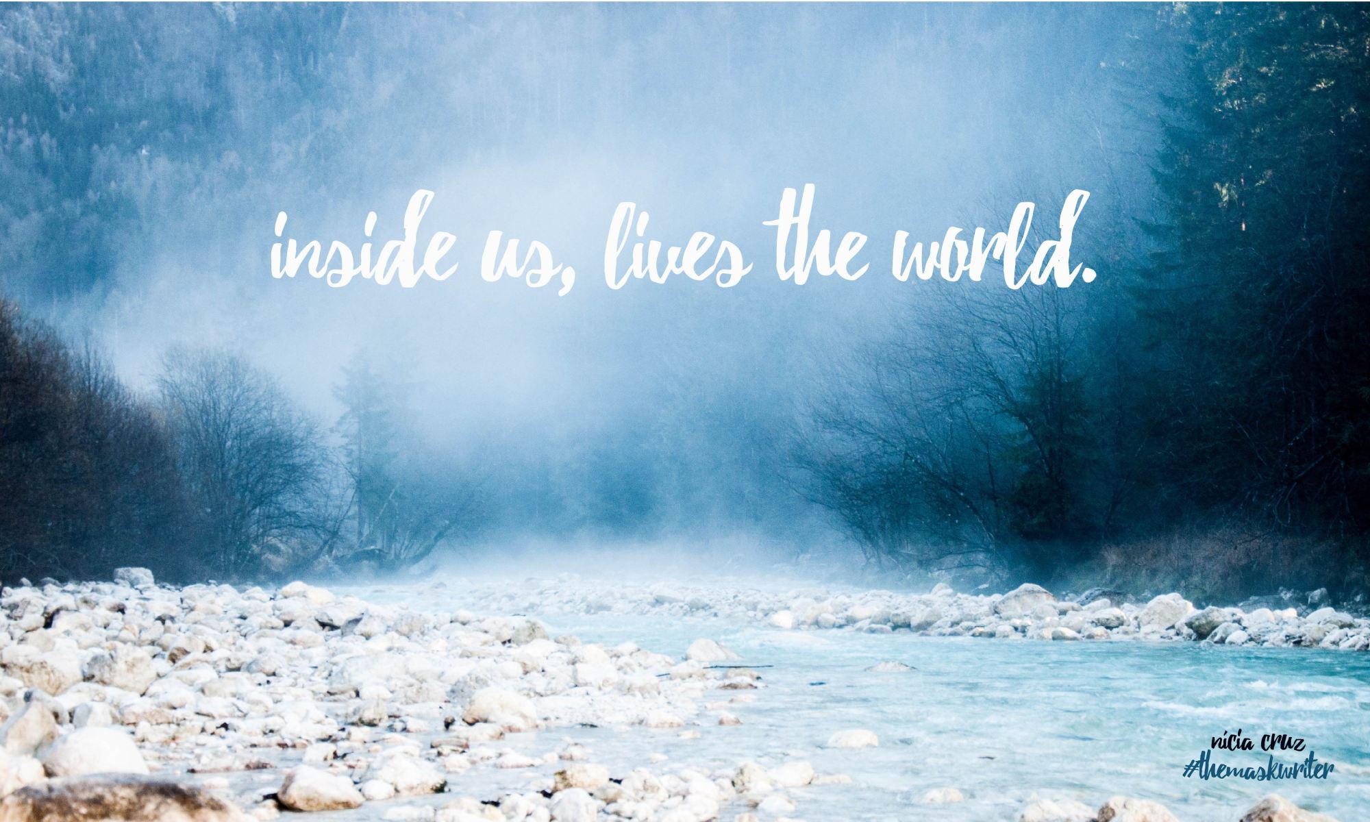 image of a blue foggy forest and some white rocks on a river. it has a quote saying: inside us, lives the world.